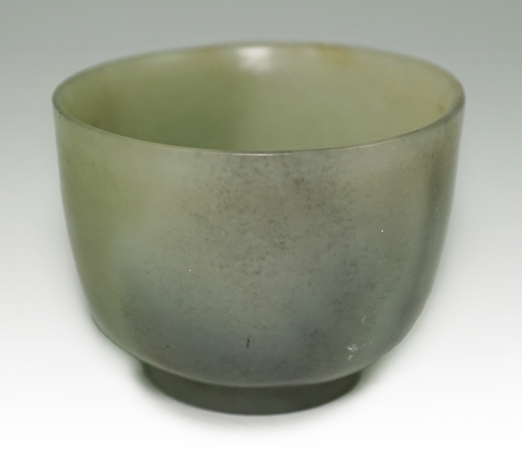 A Chinese pale celadon jade cup, 18th / 19th century